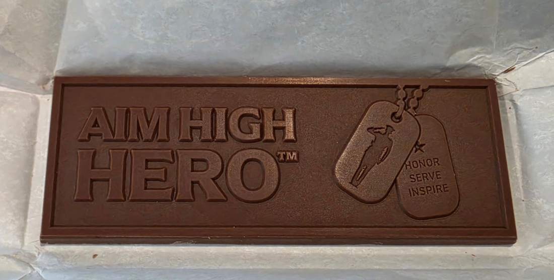 Actual Aim High Hero engraved chocolate bar with the Honor Serve Inspire dog tag design