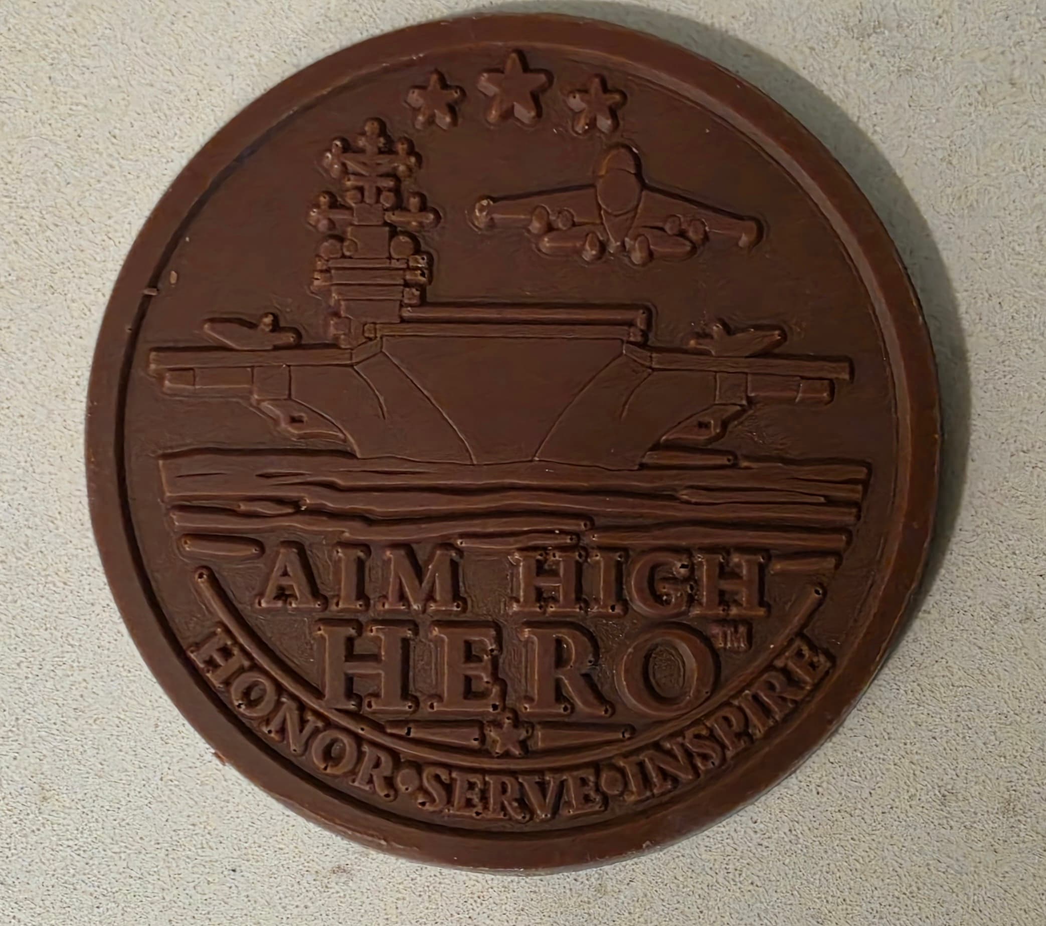 Close view of the aircraft carrier molded into the Aim High Hero chocolate coin